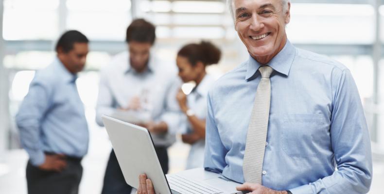 Senior-businessman-with-laptop
